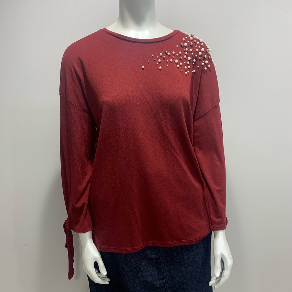 Great top, purchased in Morocco. Red with pearl accents and tie bow on sleeves